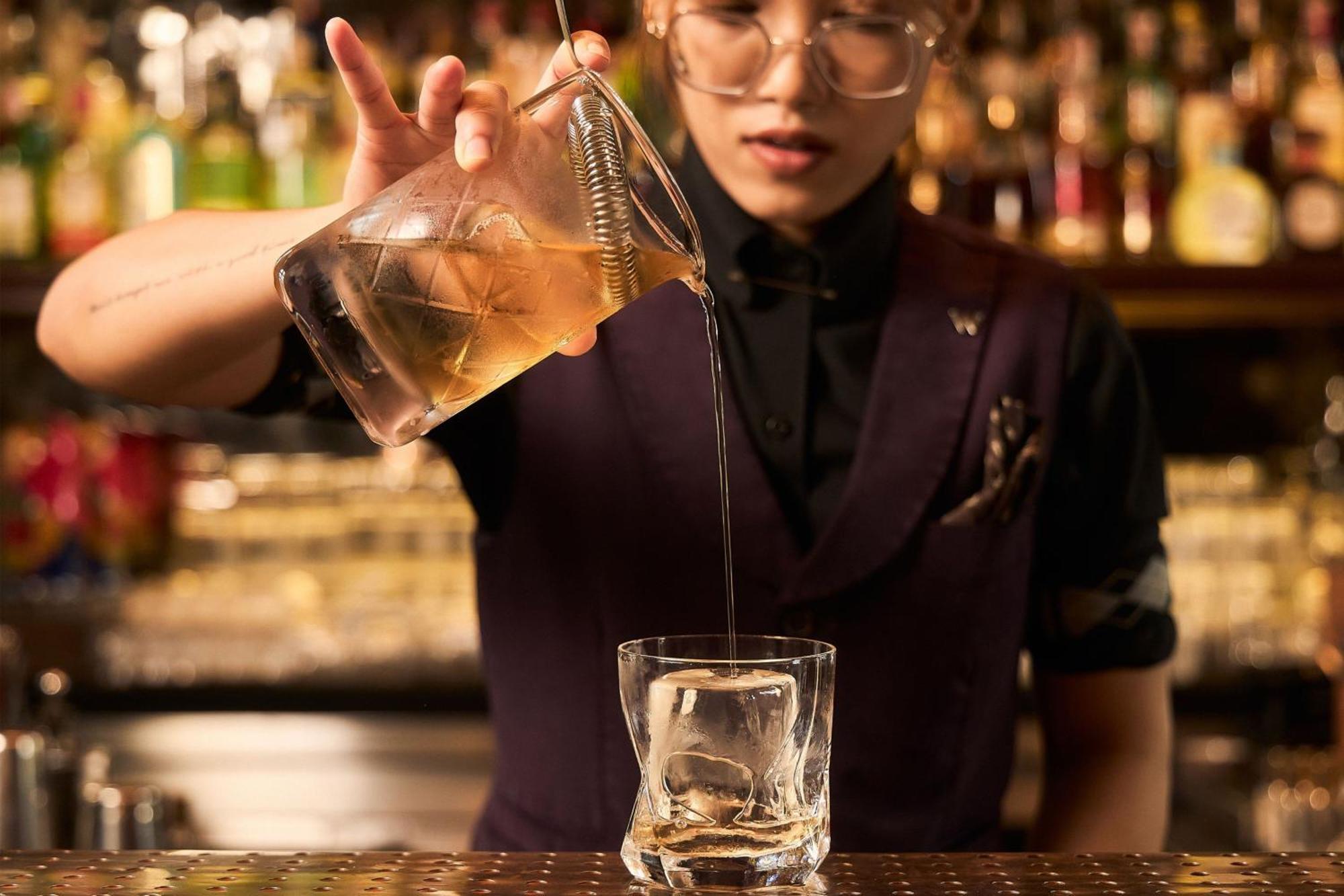 W Bangkok Hotel Exterior photo A bartender pouring a drink